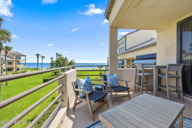 balcony featuring a water view