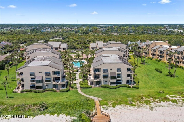 birds eye view of property with a residential view