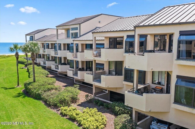 view of building exterior with a water view