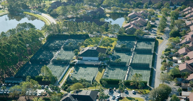 birds eye view of property featuring a water view