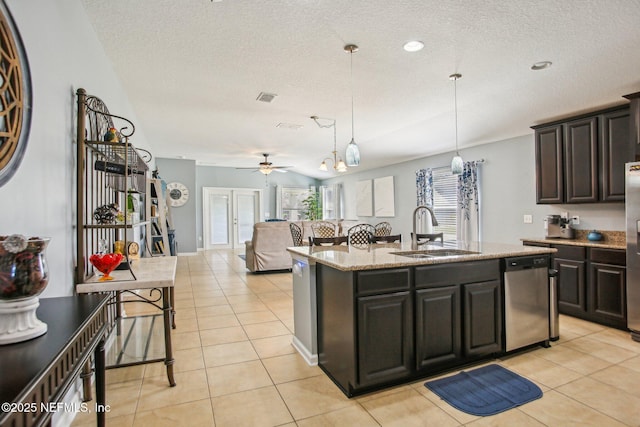 kitchen featuring light tile patterned floors, a sink, visible vents, appliances with stainless steel finishes, and pendant lighting