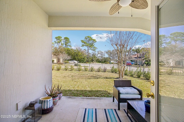 view of patio with a fenced backyard and a ceiling fan