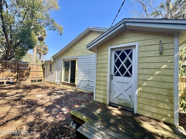 view of outbuilding featuring an outbuilding and fence