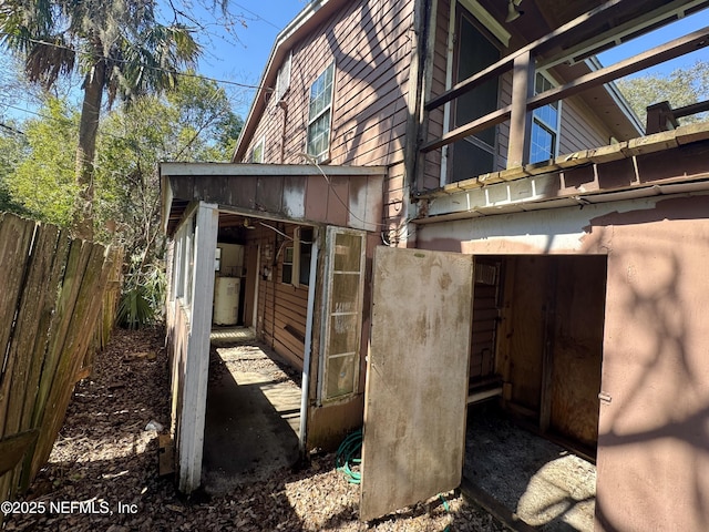 view of home's exterior featuring fence