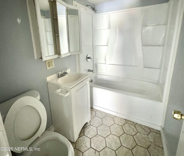 full bath featuring toilet, washtub / shower combination, and vanity