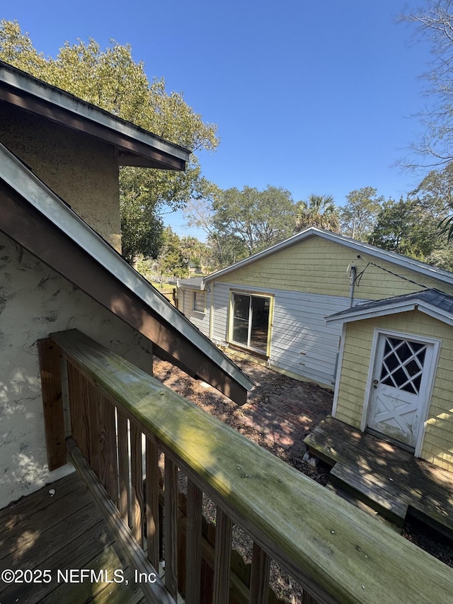 view of side of home with an outbuilding and a storage unit