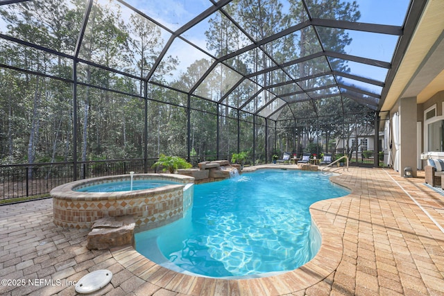 view of pool with a patio, a lanai, and a pool with connected hot tub