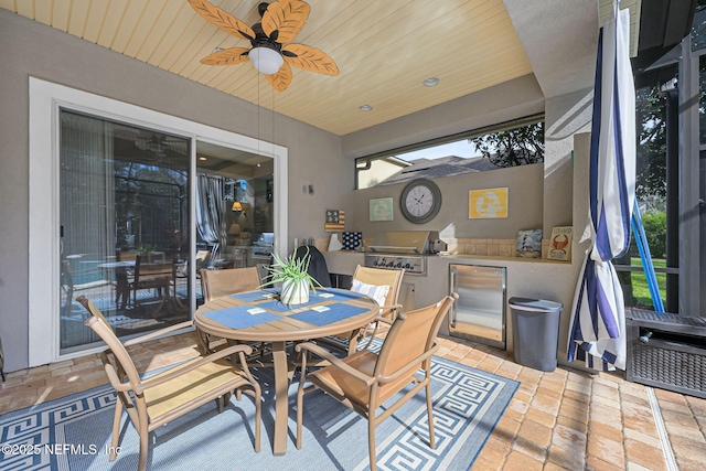 dining area featuring wooden ceiling and ceiling fan