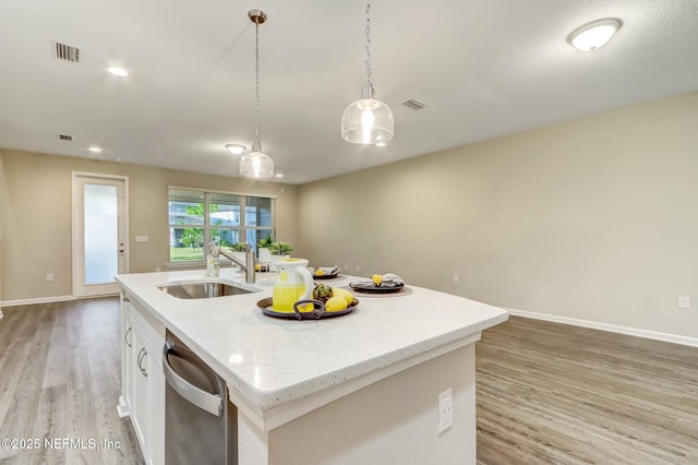 454 Pine Bluff Dr, Saint Augustine, FL 32092 - kitchen with a sink, visible vents, white cabinetry, hanging light fixtures, and a center island with sink