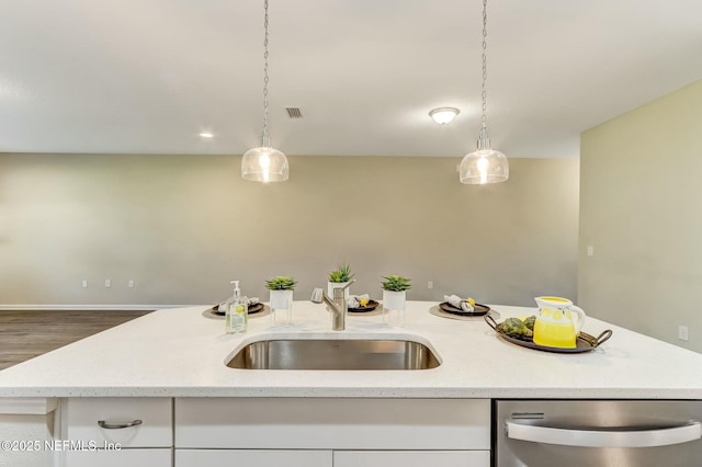 454 Pine Bluff Dr, Saint Augustine, FL 32092 - kitchen with white cabinetry, a sink, stainless steel dishwasher, and light stone countertops