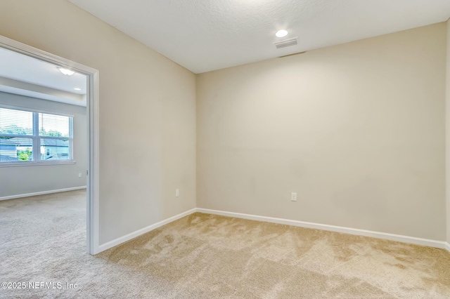 454 Pine Bluff Dr, Saint Augustine, FL 32092 - empty room featuring light carpet, a textured ceiling, visible vents, and baseboards