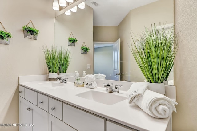 454 Pine Bluff Dr, Saint Augustine, FL 32092 - full bath featuring visible vents, a sink, and double vanity