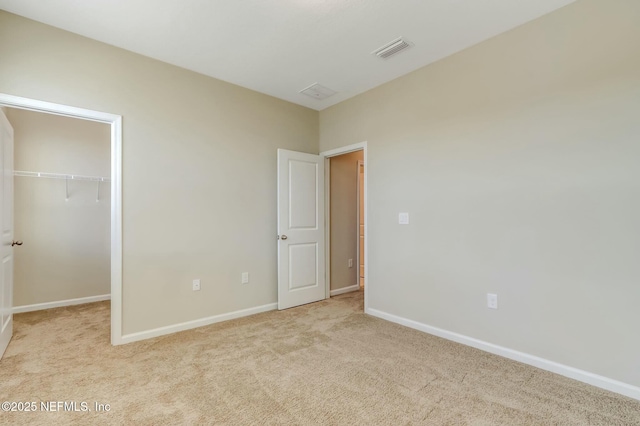 454 Pine Bluff Dr, Saint Augustine, FL 32092 - unfurnished bedroom featuring baseboards, visible vents, light colored carpet, a spacious closet, and a closet