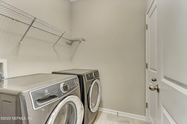 454 Pine Bluff Dr, Saint Augustine, FL 32092 - laundry area with laundry area, baseboards, and separate washer and dryer