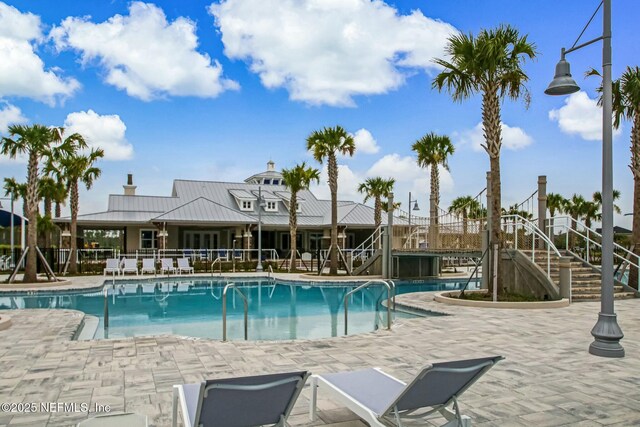 454 Pine Bluff Dr, Saint Augustine, FL 32092 - community pool featuring a patio, stairway, and fence