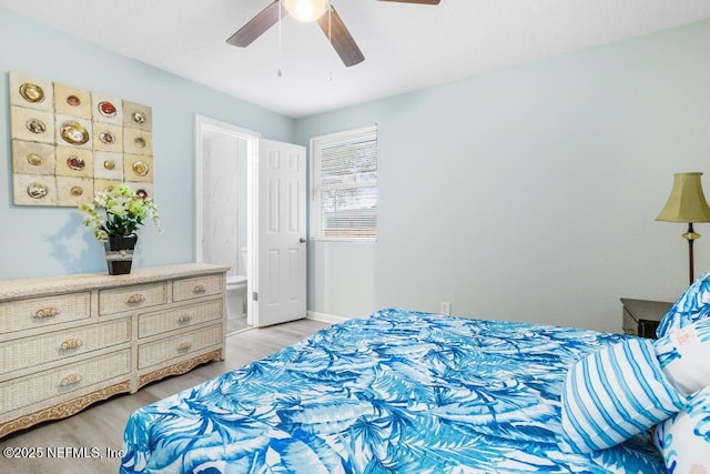 bedroom featuring baseboards, light wood-style flooring, and a ceiling fan