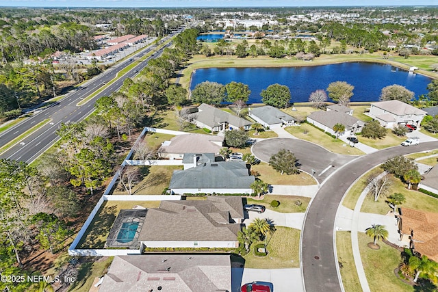 bird's eye view featuring a water view and a residential view