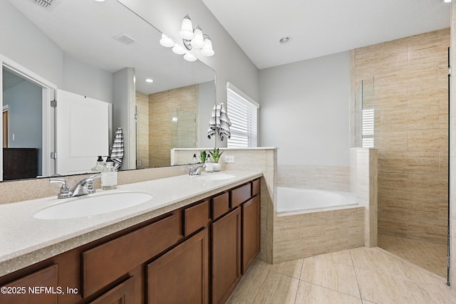 bathroom featuring a garden tub, a sink, a tile shower, and double vanity