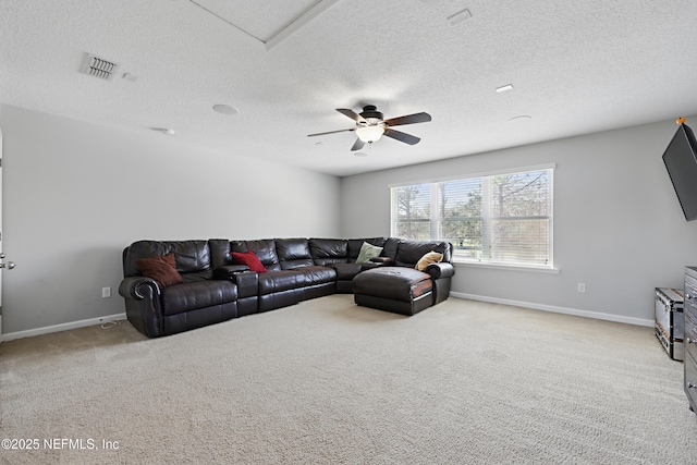 living room featuring carpet, visible vents, ceiling fan, and baseboards