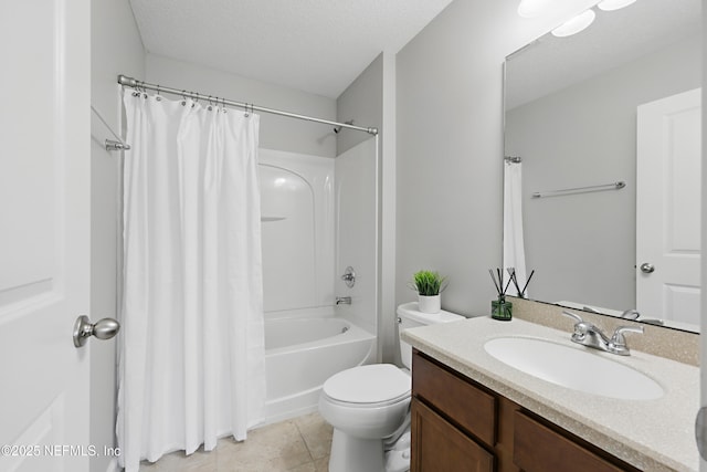 bathroom with toilet, shower / tub combo with curtain, tile patterned floors, a textured ceiling, and vanity