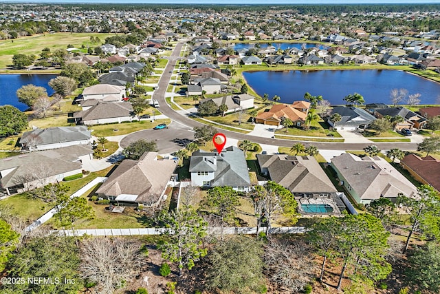 aerial view with a residential view and a water view