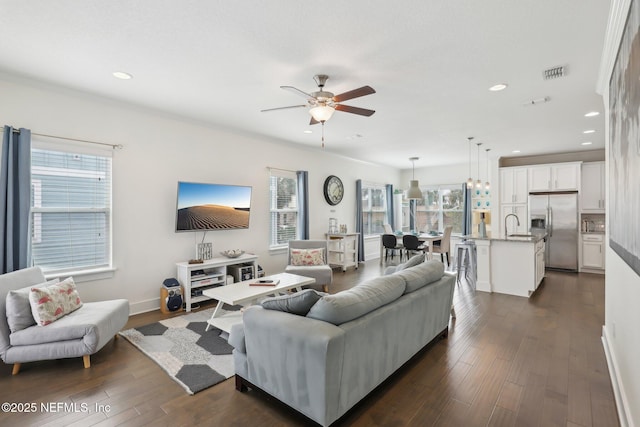 342 4th St N, Jacksonville Beach, FL 32250 - living area featuring dark wood-style floors, a wealth of natural light, and visible vents