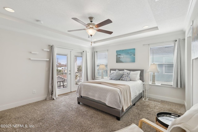 342 4th St N, Jacksonville Beach, FL 32250 - bedroom featuring baseboards, a raised ceiling, access to exterior, a textured ceiling, and french doors