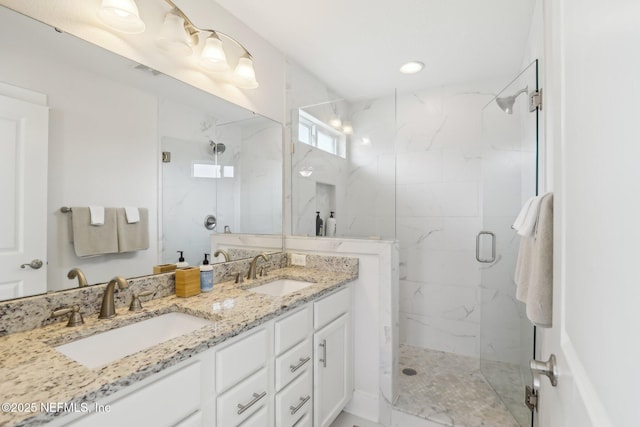 342 4th St N, Jacksonville Beach, FL 32250 - full bath with double vanity, a sink, and a marble finish shower
