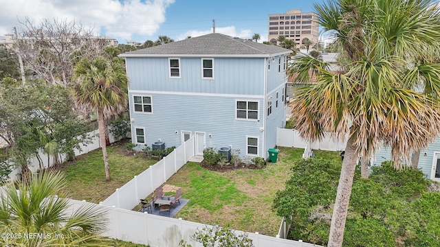 342 4th St N, Jacksonville Beach, FL 32250 - exterior space with a fenced backyard, cooling unit, and a lawn