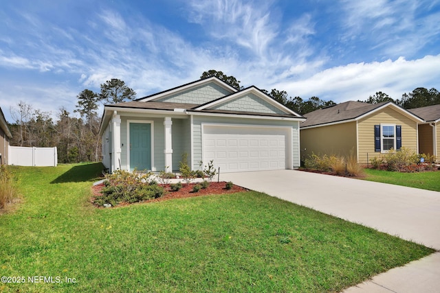 view of front of property featuring a garage, a front yard, concrete driveway, and fence