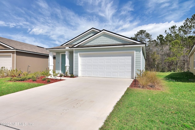 view of front of house featuring concrete driveway, a front lawn, and an attached garage