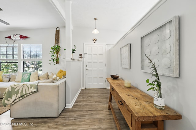 entryway featuring baseboards and wood finished floors