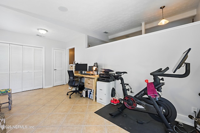 office featuring light tile patterned flooring and visible vents