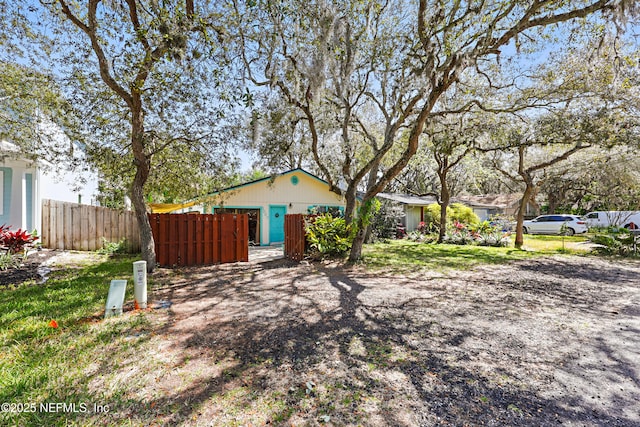 view of front of house featuring fence