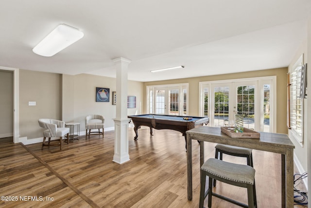 recreation room with pool table, wood finished floors, baseboards, french doors, and ornate columns