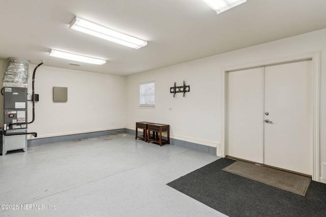 garage featuring baseboards