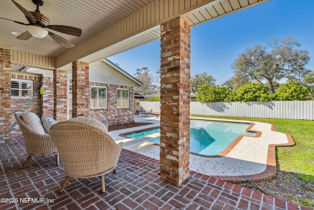 view of pool featuring a patio, a fenced backyard, a ceiling fan, and a fenced in pool