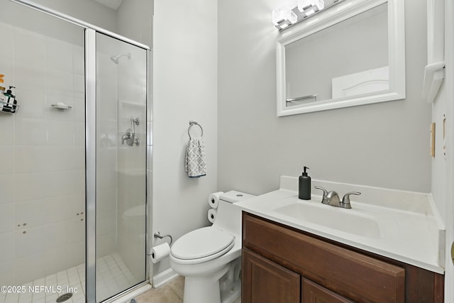 full bathroom featuring a stall shower, vanity, and toilet