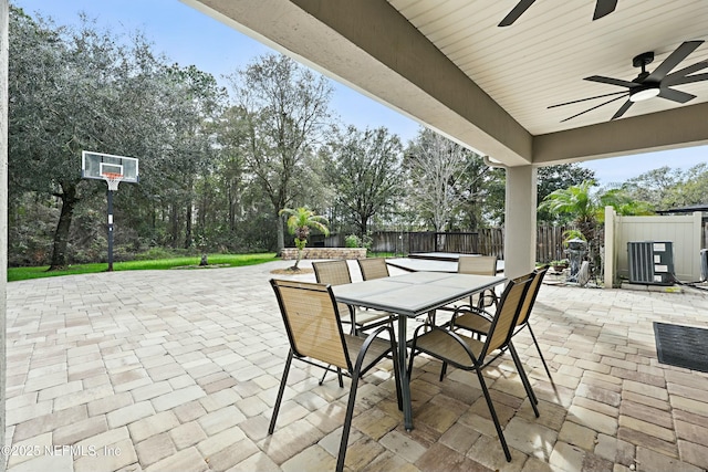 view of patio / terrace with outdoor dining area, a fenced backyard, and ceiling fan