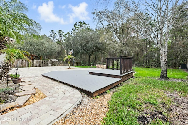 view of basketball court with fence