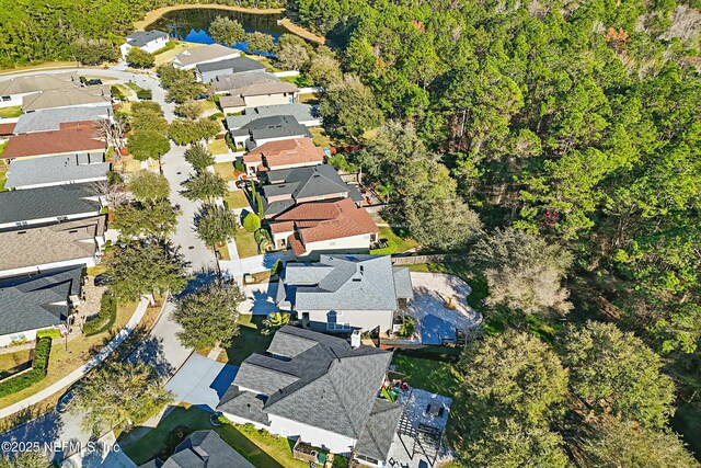 birds eye view of property with a residential view