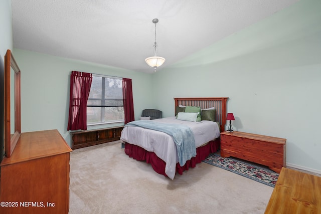 bedroom with light carpet and vaulted ceiling