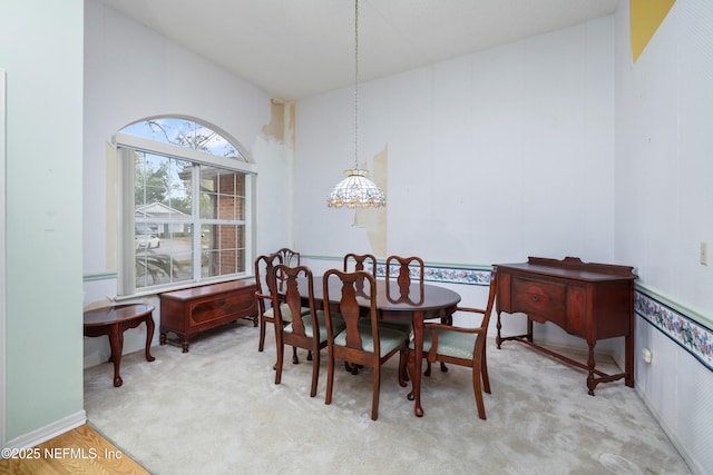 dining area with vaulted ceiling