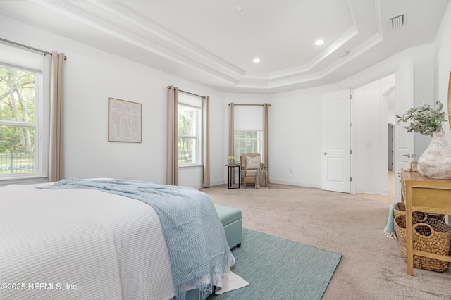 bedroom featuring light colored carpet, visible vents, crown molding, and multiple windows