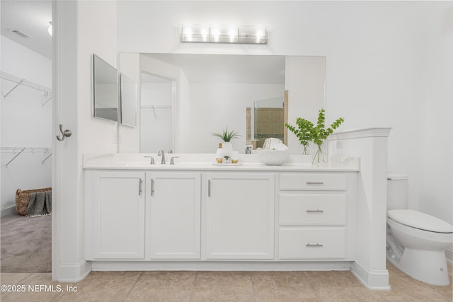 full bathroom with visible vents, toilet, vanity, a shower stall, and tile patterned flooring