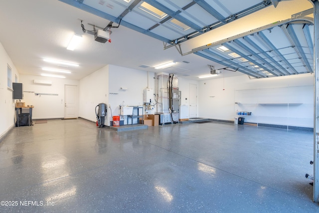 garage featuring water heater, electric panel, and a garage door opener