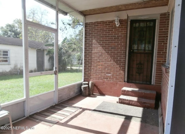 unfurnished sunroom featuring plenty of natural light