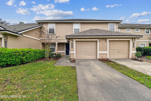 view of front of property featuring a garage, a shingled roof, concrete driveway, stucco siding, and a front lawn