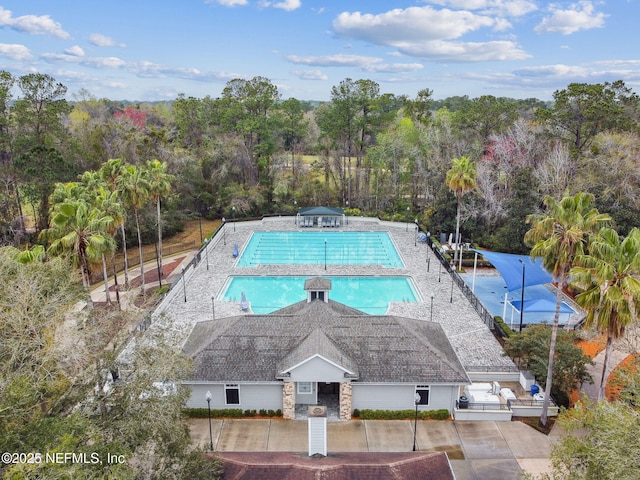 view of pool featuring a patio and fence