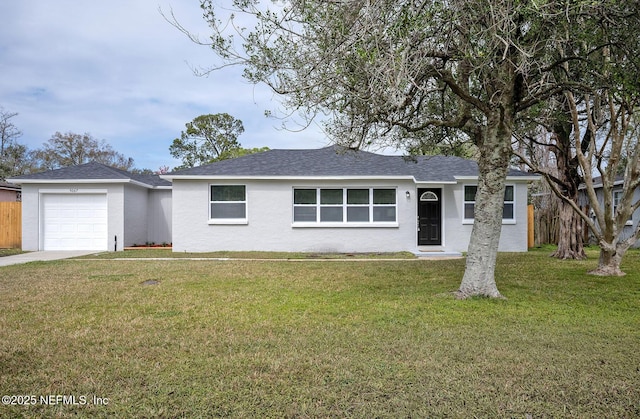 ranch-style house with a garage, a front lawn, and stucco siding